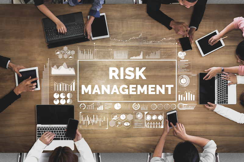 Risk Management-Blog Image risk management discussion around the table
