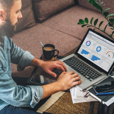 Man working on accrued expenses report in Accounting Seed