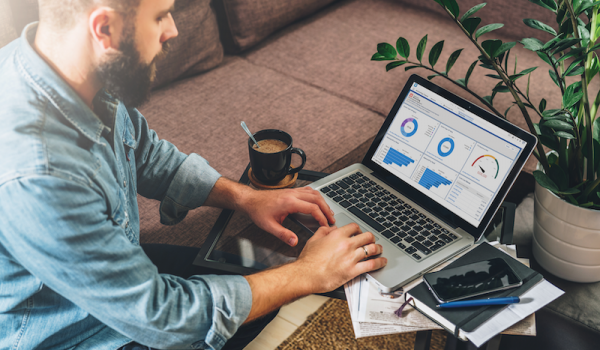 Man working on accrued expenses report in Accounting Seed