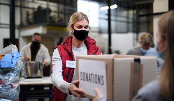 Woman accepting box of donations