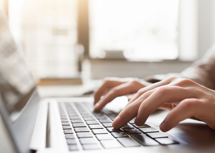 stylized photo of hands on keyboard