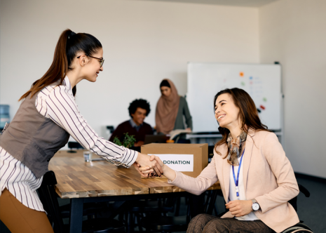 Photos of non-profit women shaking hands