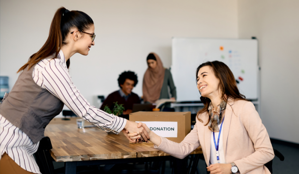 Photos of non-profit women shaking hands