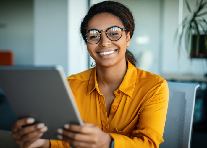 Woman using accounting software on the tablet to streamline accounts payable processes