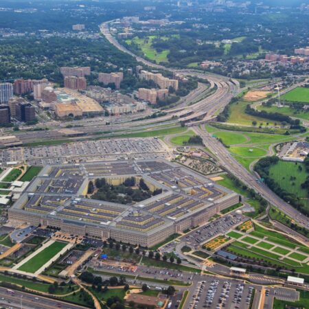 Aerial view of the United States Pentagon, the Department of Defense headquarters in Arlington, Virginia, near Washington DC, with I-395 freeway and the Air Force Memorial and Arlington Cemetery nearby