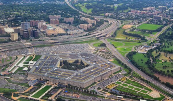 Aerial view of the United States Pentagon, the Department of Defense headquarters in Arlington, Virginia, near Washington DC, with I-395 freeway and the Air Force Memorial and Arlington Cemetery nearby